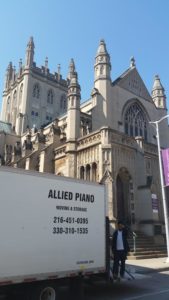 Allied Piano moving truck delivering piano to church